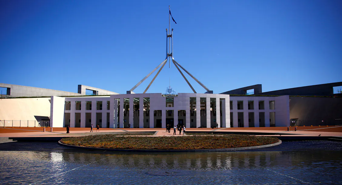 Tourists walk around the forecourt of Australia's Parliament House in Canberra, Australia, on Oct. 16, 2017. (REUTERS/David Gray/File Photo)