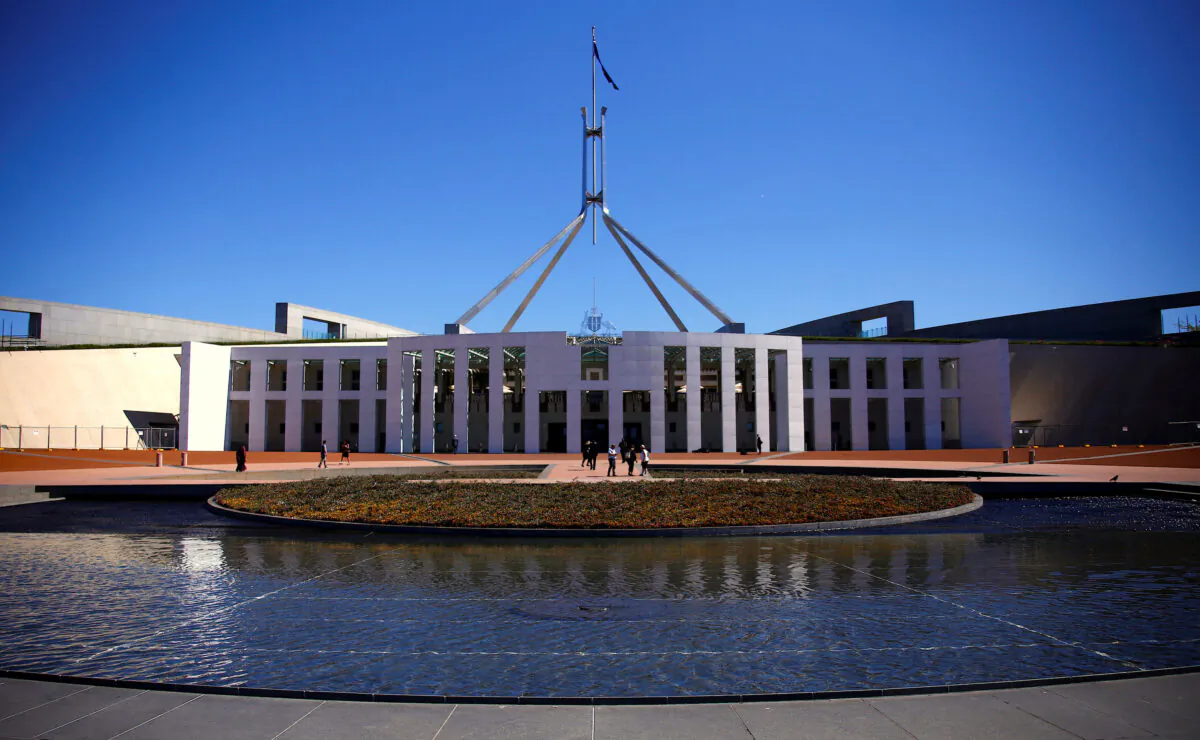 Tourists walk around the forecourt of Australia's Parliament House in Canberra, Australia on Oct. 16, 2017. (David Gray/Reuters)