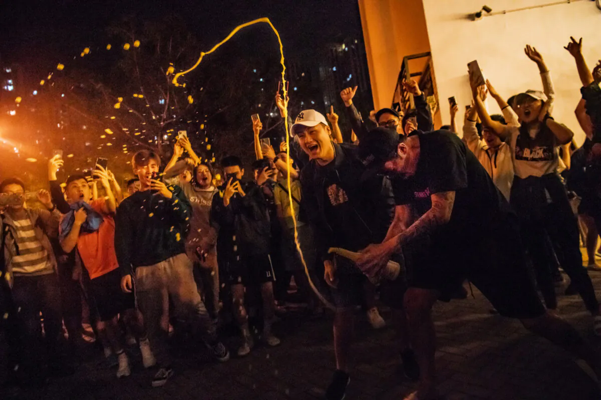 Local residents celebrate outside a polling station as Junius Ho Kwan-yiu loses in District Council Elections in Hong Kong, on Nov. 25, 2019. (Billy H.C. Kwok/Getty Images)
