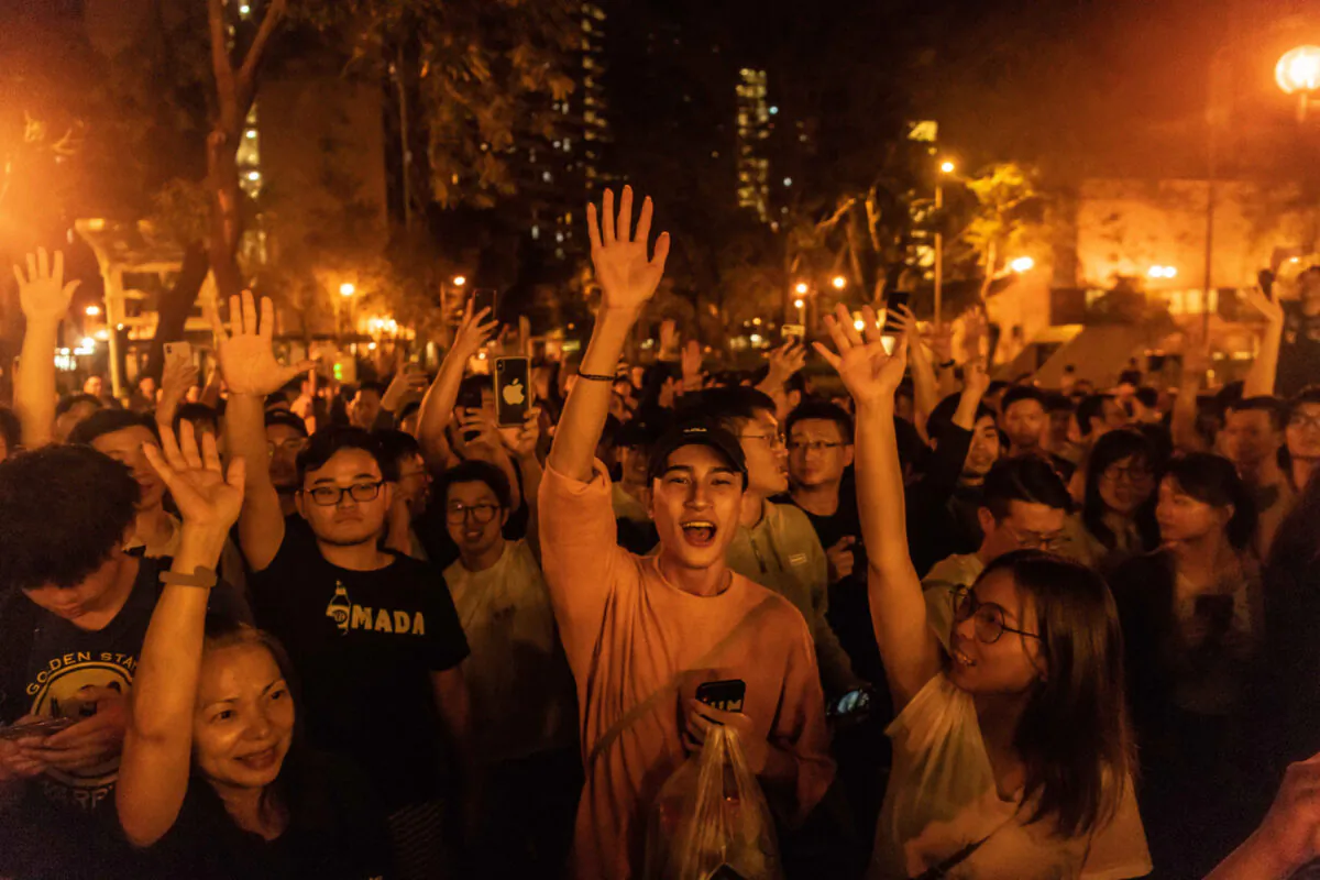 Local residents celebrate as Junius Ho Kwan-yiu loses in District Council Elections, outside a polling station in Hong Kong, on Nov. 25, 2019. (Billy H.C. Kwok/Getty Images)