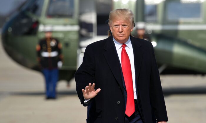 US President Donald Trump makes his way to board Air Force One before departing from Andrews Air Force Base in Maryland on November 20, 2019. (Photo by MANDEL NGAN/AFP via Getty Images)