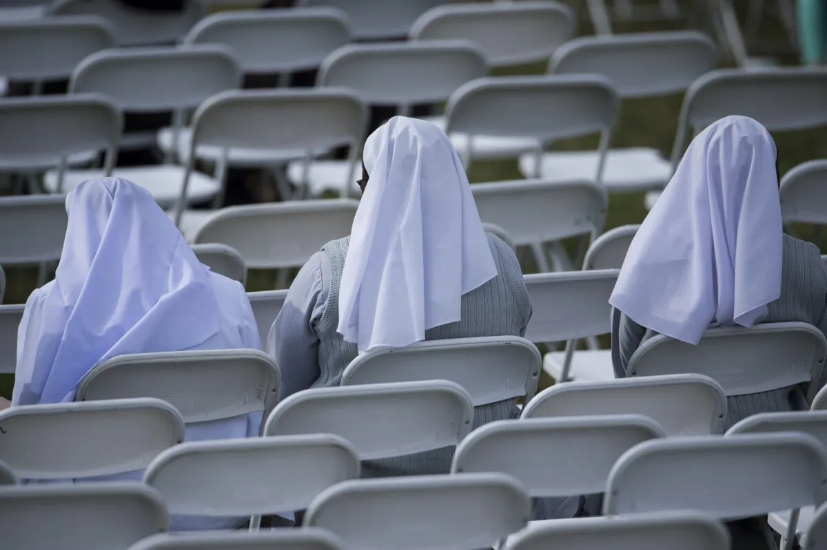 Nuns wait for Pope Francis at Independence Hall Sept. 26, 2015 in Philadelphia, Pennsylvania. (BRENDAN SMIALOWSKI/AFP via Getty Images)