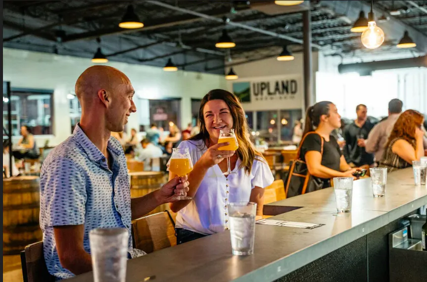 Inspired by the creativity of their Fountain Square neighbors, Upland FSQ features a small-batch brewery for tinkering and barrel-aging, 22 beers on tap, a beautiful outdoor patio, and a locally-focused menu of spirited pub classics and vegetarian cuisine. (Cliff Ritchey/Visit Indy)