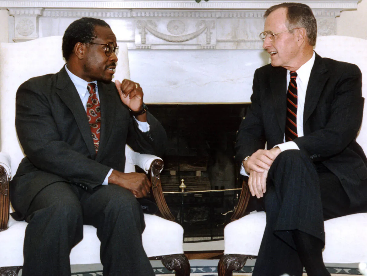 President George Bush, right, meets with his Supreme Court nominee Clarence Thomas in the Oval Office of the White House in Washington, Oct. 9, 1991. (J. David Ake/AFP via Getty Images)