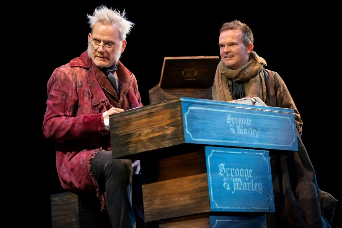 Ebenezer Scrooge (Campbell Scott) and his bookkeeper, Bob Cratchit (Dashiell Eaves) as they appear in Jack Thorne’s stage adaptation of “A Christmas Carol.” (Joan Marcus)