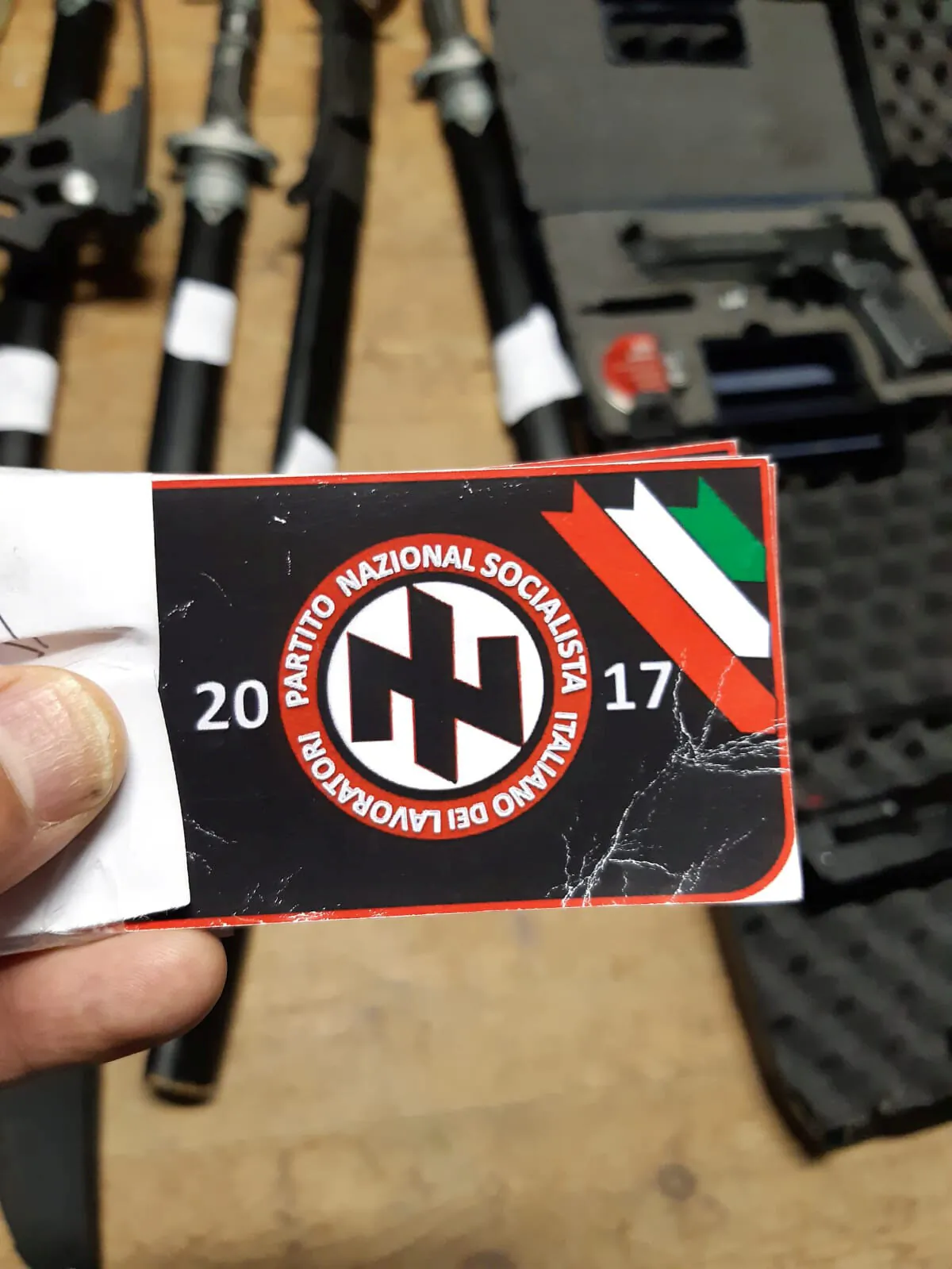 Italian police handout shows a sticker with the symbol of the 'Italian National Socialist Workers' Party' that they say was seized in searches of properties of an extremist group who planned to create a new Nazi party, in an unidentified location in Italy in a picture released on Nov. 28, 2019. (Polizia di Stato/Handout via Reuters)