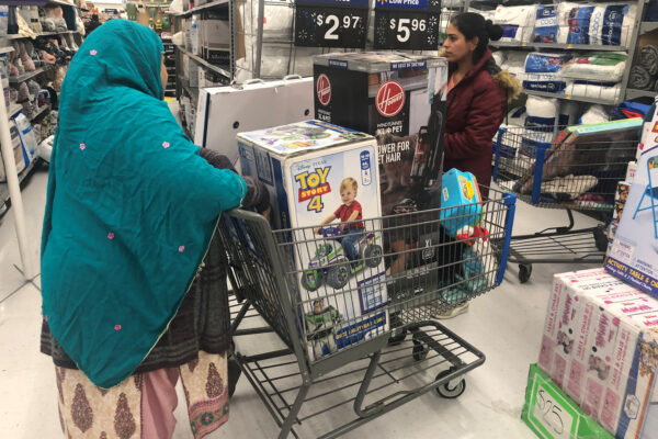 People shop during a sales event on Thanksgiving day at Walmart in Westbury, New York