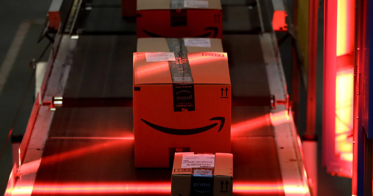 Packages riding on a belt are scanned to be loaded onto delivery trucks at the Amazon Fulfillment center in Robbinsville Township, N.J. on Aug. 1, 2017. (Julio Cortez/AP/File)