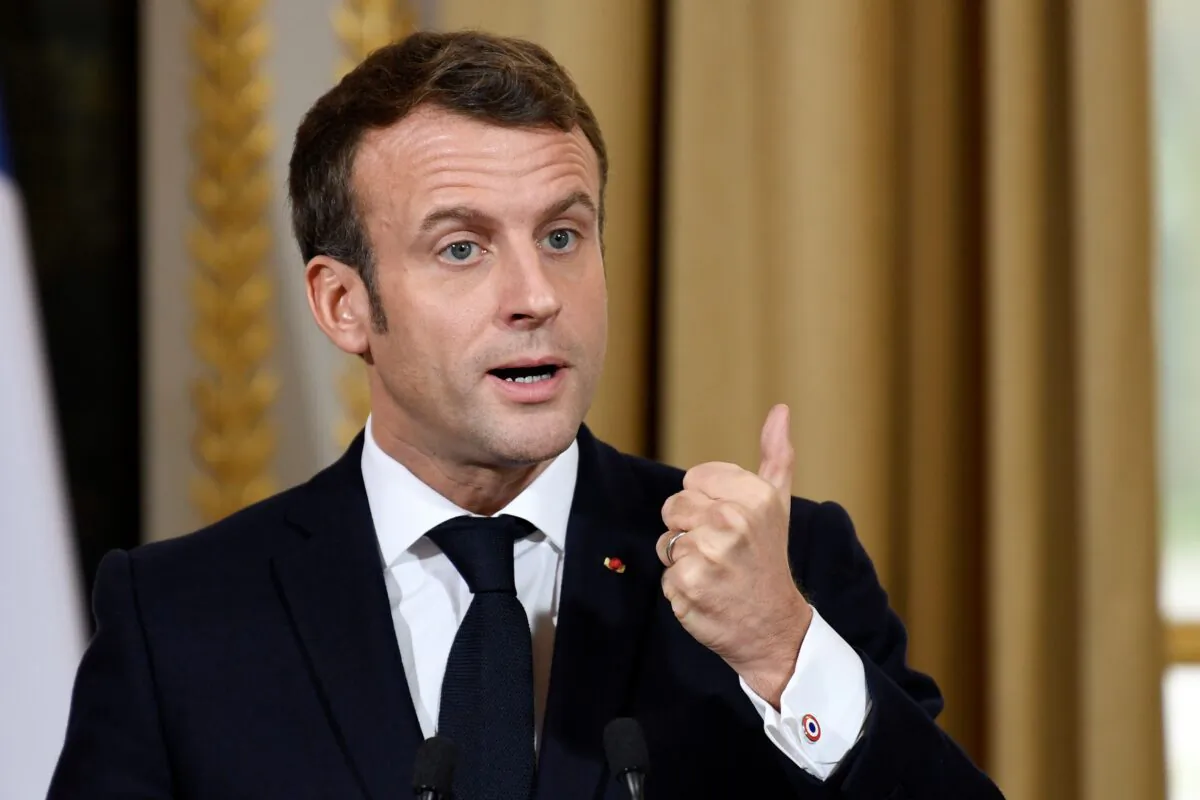 French President Emmanuel Macron takes part in a news conference with NATO Secretary General Jens Stoltenberg after their meeting at the Elysee palace in Paris, France, on Nov. 28, 2019. (Bertrand Guay/Pool via Reuters)
