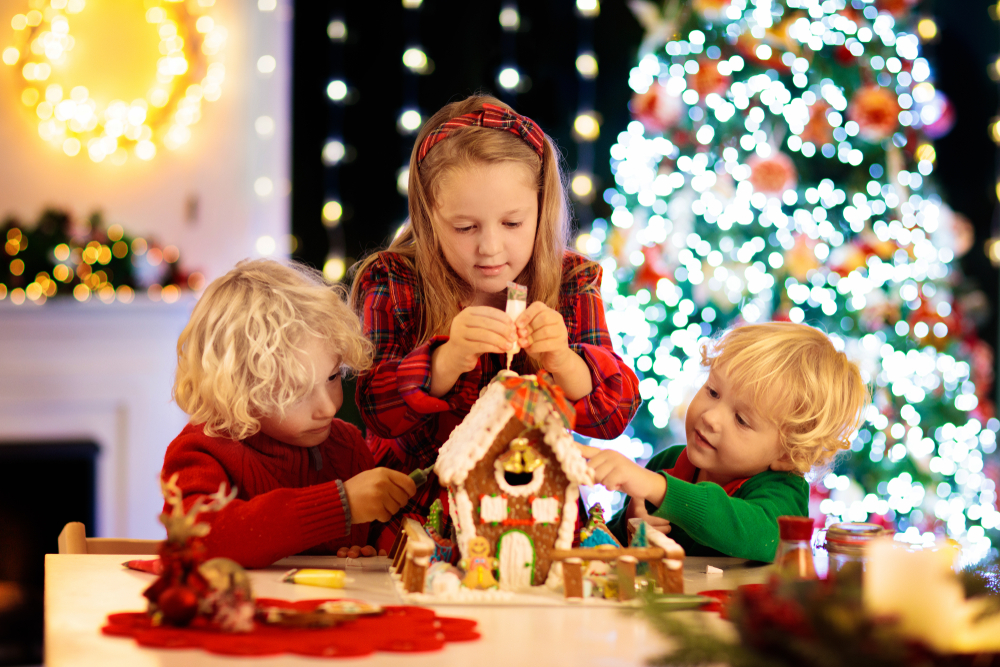 kids building a gingerbread house