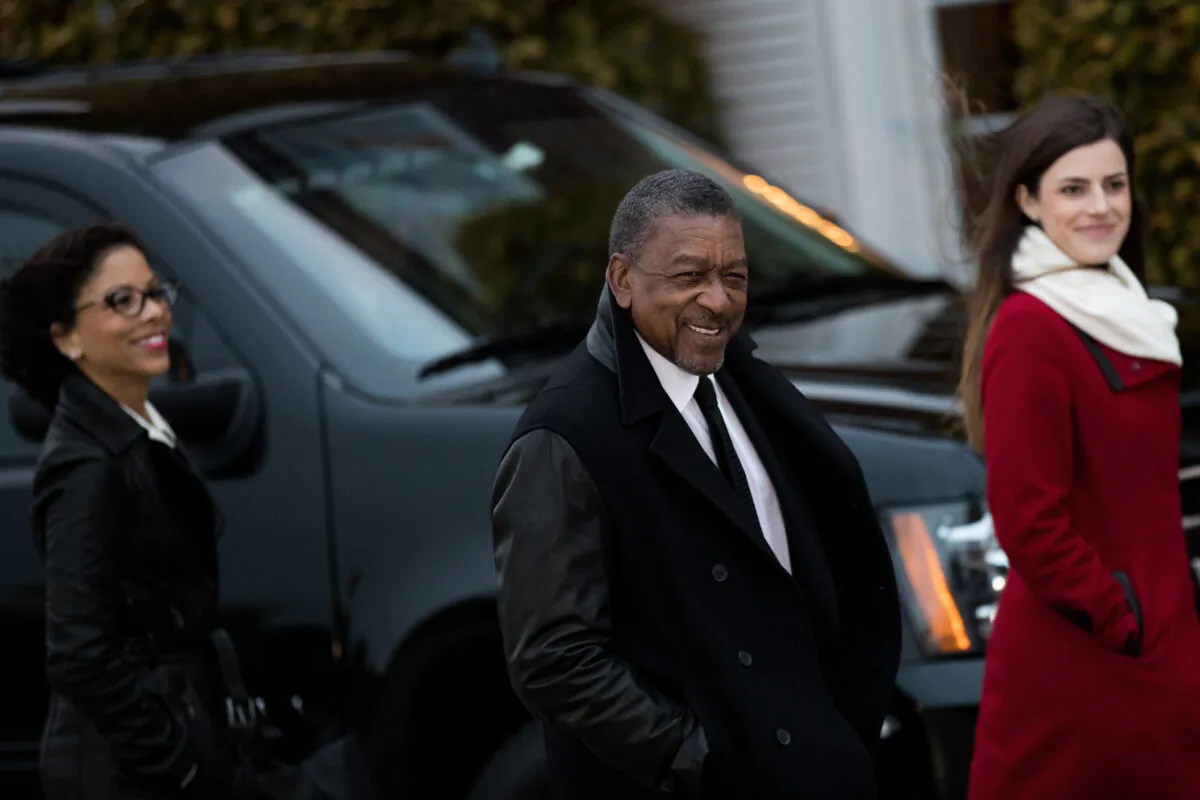 Robert Johnson, center, the founder of Black Entertainment Television, arrives for a meeting with president-elect Donald Trump at Trump International Golf Club in Bedminster Township, New Jersey on Nov. 20, 2016. (Drew Angerer/Getty Images)