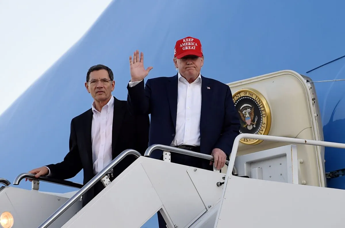 President Donald Trump steps off Air Force One upon arrival at Palm Beach International Airport, in West Palm Beach, Florida on Nov. 29, 2019. (Olivier Douliery/AFP via Getty Images)