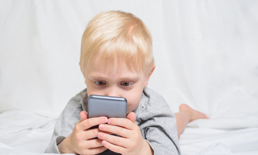 A game or video can provide parents a much needed respite, but too much screen time can harm their child's development. (somemeans/Shutterstock)
