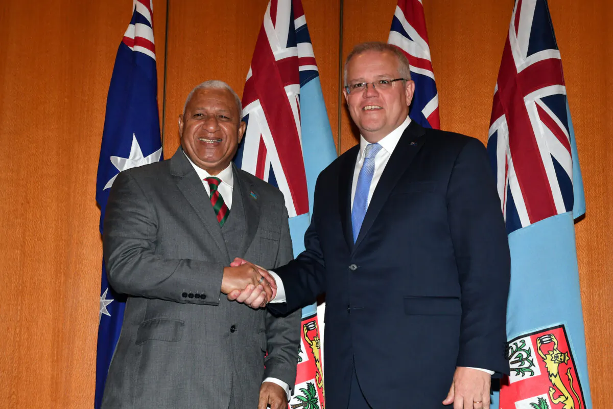 Fiji's Prime Minister Josaia Voreqe Bainimarama and Australia's Prime Minister Scott Morrison pose for photographs before a bilateral meeting at Parliament House in Canberra, Monday, Sept. 16, 2019. (Mick Tsikas-Pool/Getty Images)