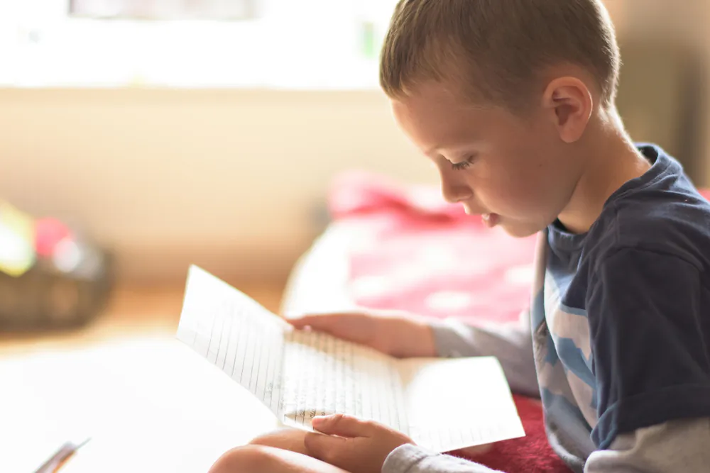 Kids love to receive mail—why not send a letter to the kids in your family every week? (Shutterstock)