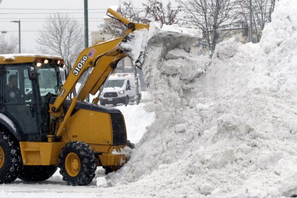 front end loader piles snow