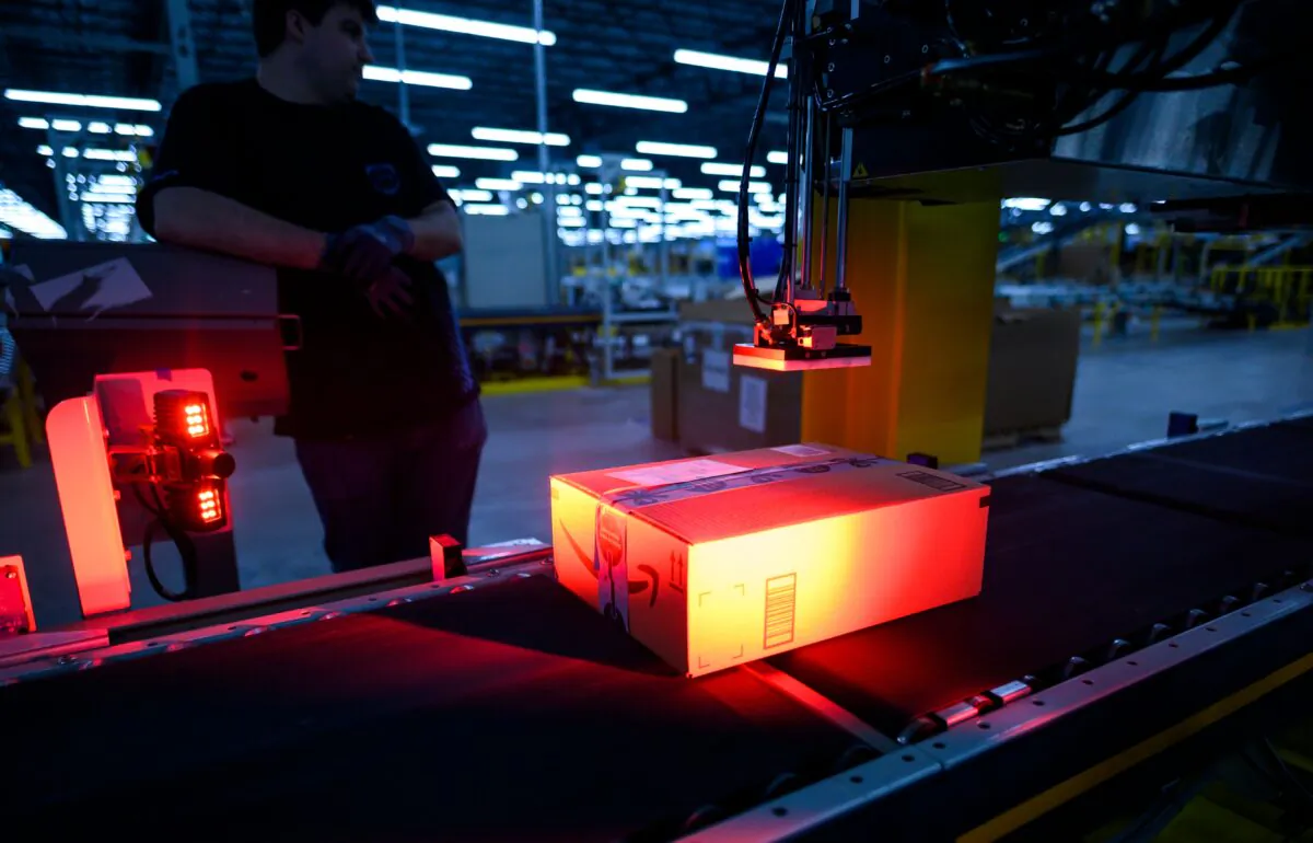 A man monitors the addressing process at the 855,000-square-foot Amazon fulfillment center in Staten Island, one of the five boroughs of New York City, on Feb. 5, 2019. (JOHANNES EISELE/AFP via Getty Images)