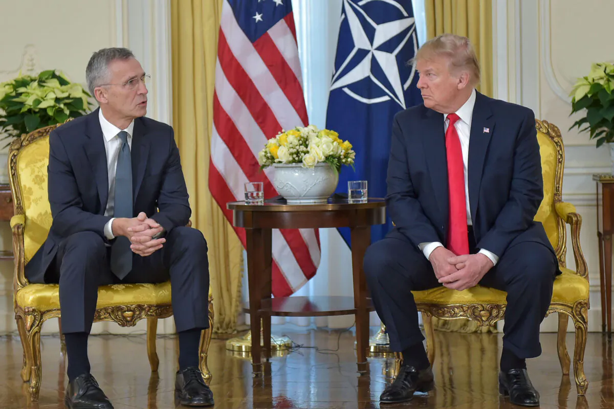 In this handout provided by NATO, Jens Stoltenberg, Secretary General of NATO speaks with U.S. President Donald Trump ahead of the NATO Leaders meeting at the NATO HQ on December 3, 2019 in Watford, England. (Photo by NATO handout via Getty Images)
