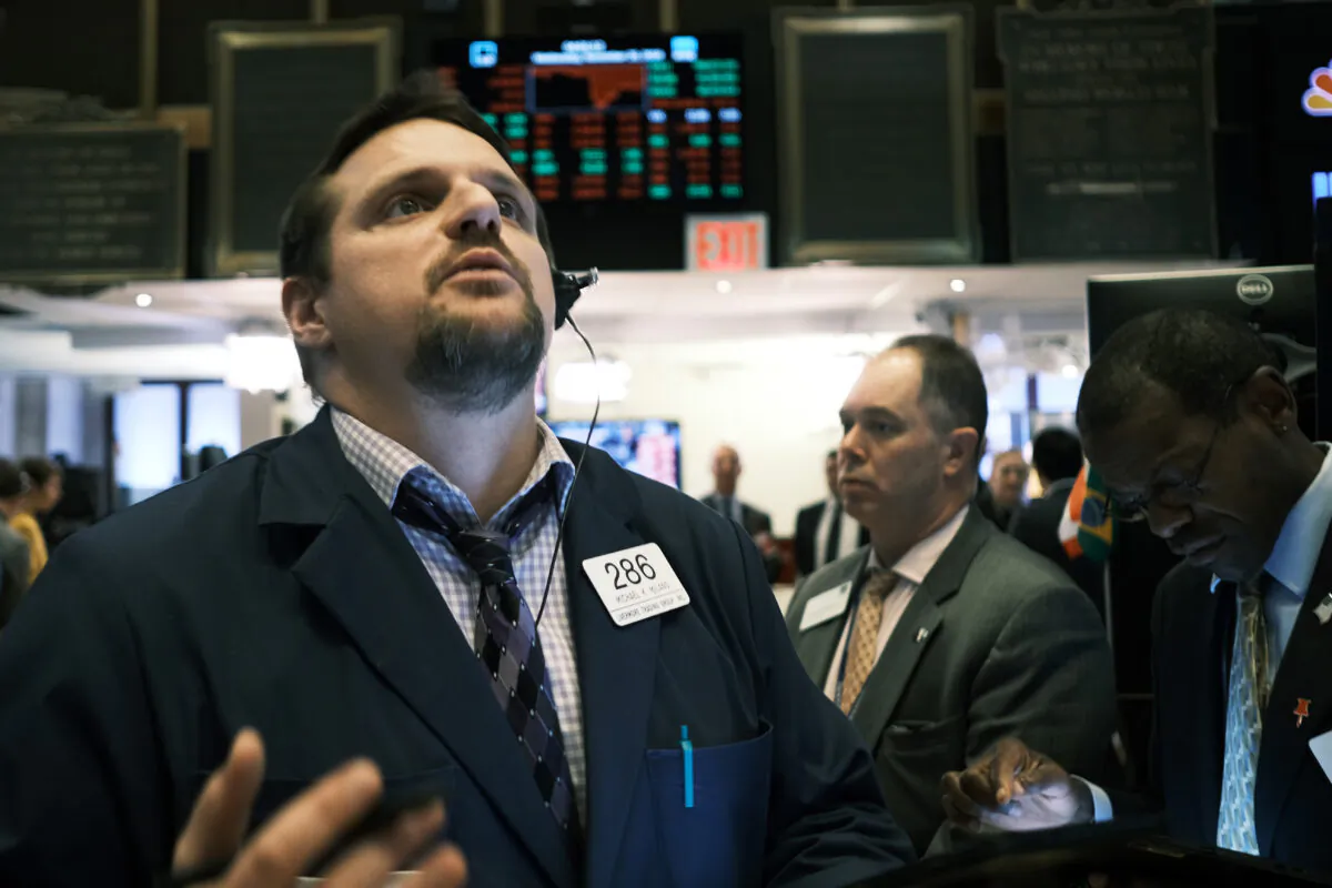 Traders work on the floor of the New York Stock Exchange (NYSE) in New York City, on Nov. 20, 2019. (Spencer Platt/Getty Images)
