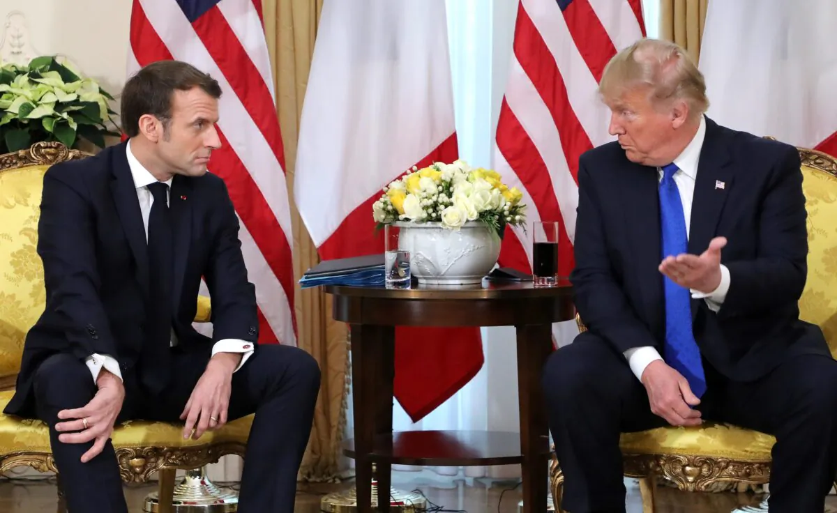 President Donald Trump (R) France's President Emmanuel Macron react as they talk during their meeting at Winfield House, London on Dec. 3, 2019. (Ludovic Marin/AFP via Getty Images)