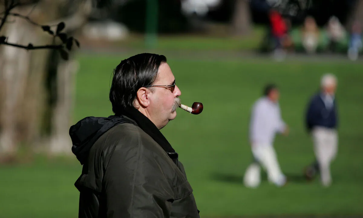 A man smokes a pipe as he walks through Washington Square Park in San Francisco, Calif., on Jan. 26, 2005. (Justin Sullivan/Getty Images)