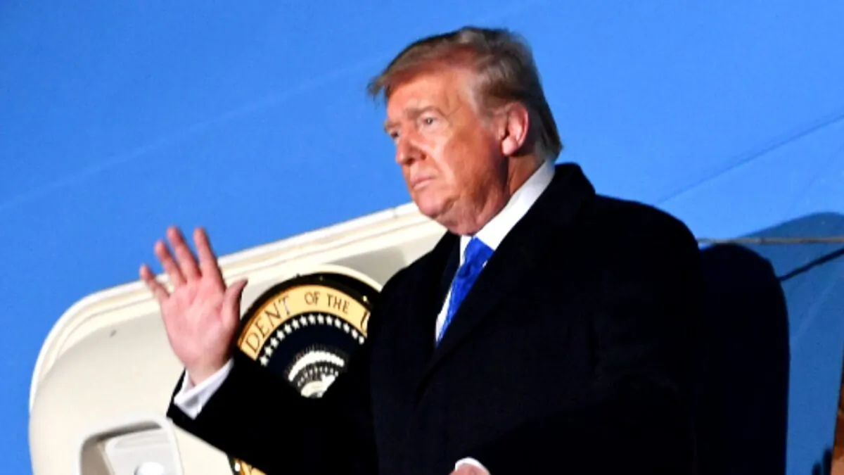 President Donald Trump and First Lady Melania Trump (not pictured) disembark Air Force One after landing at Stansted Airport, northeast of London on Dec. 2, 2019. (Nicholas Kamm/AFP via Getty Images)