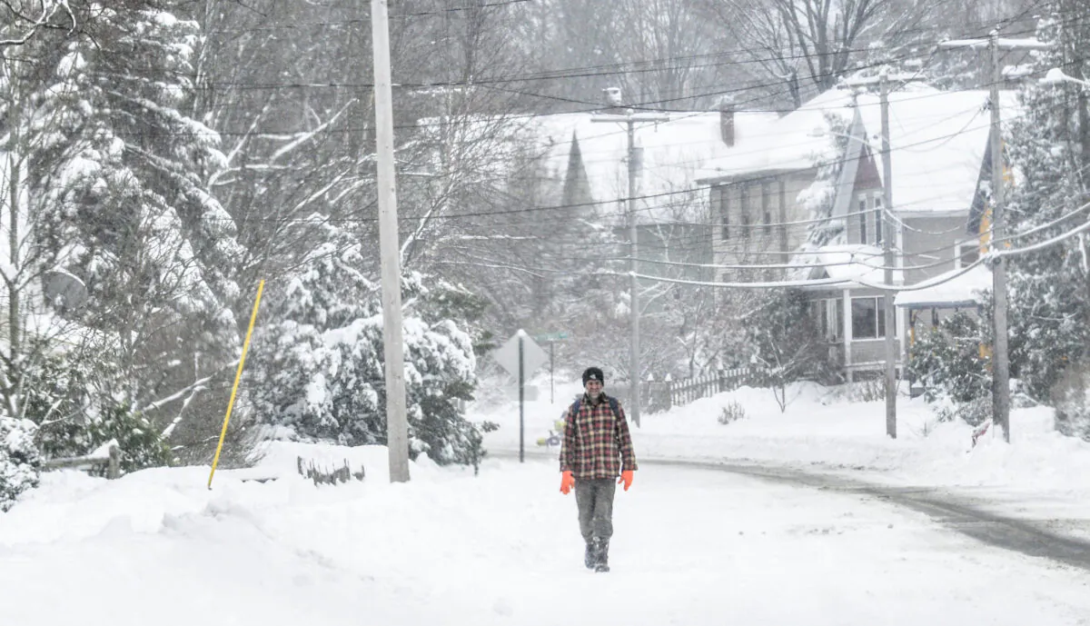 A man walks on South Main Street in Brattleboro, Vt., on Dec. 2, 2019. (Kristopher Radder/The Brattleboro Reformer via AP)