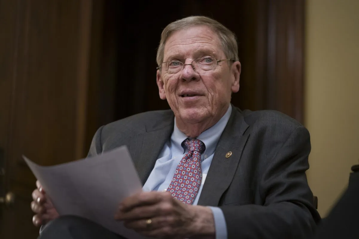 Sen. Johnny Isakson (R-Ga.) meets with his staff in his office on Capitol Hill in Washington on Dec. 2, 2019. (J. Scott Applewhite/AP Photo)