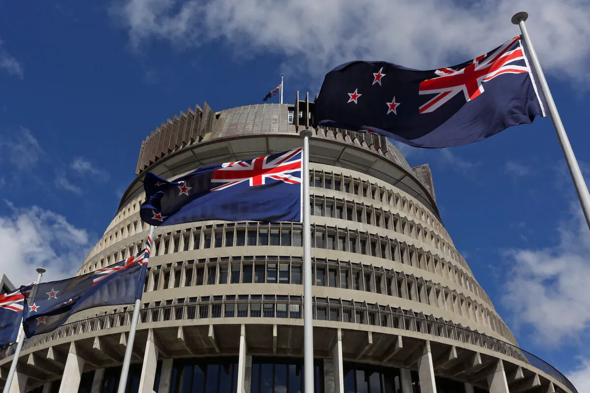 New Zealand flags fly in front of The Beehive during the Commission Opening of Parliament in Wellington, New Zealand, on Oct. 20, 2014. (Hagen Hopkins/Getty Images)