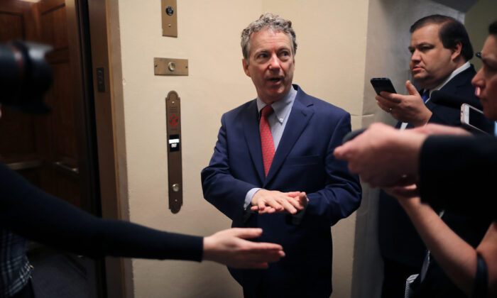 Sen. Rand Paul (R-Ky.) talks to reporters as he heads to the U.S. Capitol for the weekly Republican policy luncheon in Washington on March 5, 2019.  (Chip Somodevilla/Getty Images)