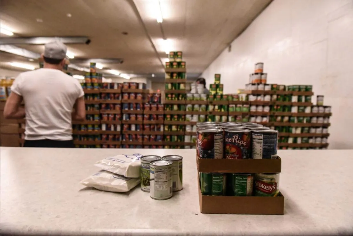 A worker places packaged food onto a counter inside of a food distribution center on the Cheyenne River Indian Reservation in Eagle Butte, South Dakota, on Jan. 25, 2019. (Stephanie Keith/File Photo/Reuters)