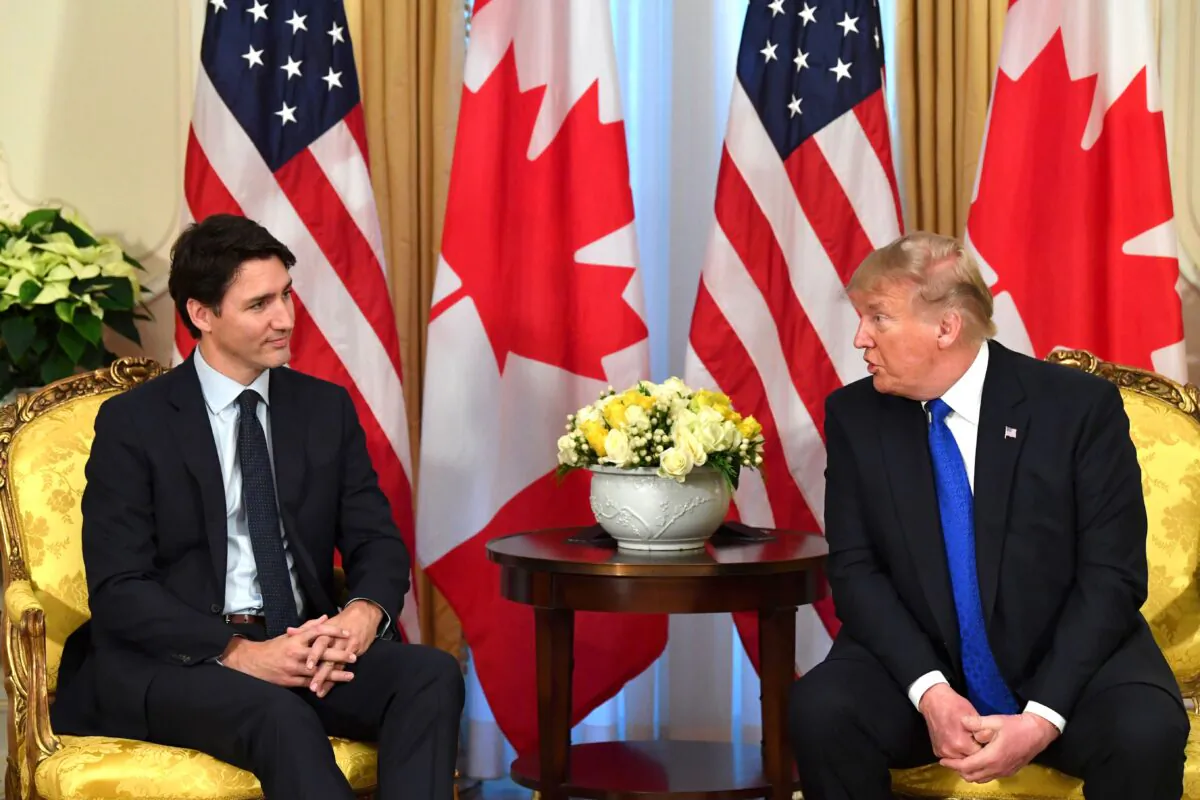 U.S. President Donald Trump (R) talks with Canada's Prime Minister Justin Trudeau during a meeting at Winfield House, London on Dec. 3, 2019. (Nicholas Kamm/AFP via Getty Images)