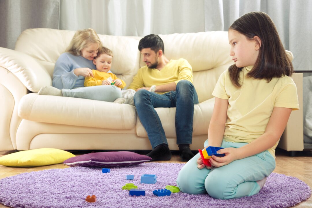 One child is often more easygoing and agreeable than the other, and that can lead to that other child getting less attention—and working harder in life to make up for it. (Tatyana Dzemileva/Shutterstock)