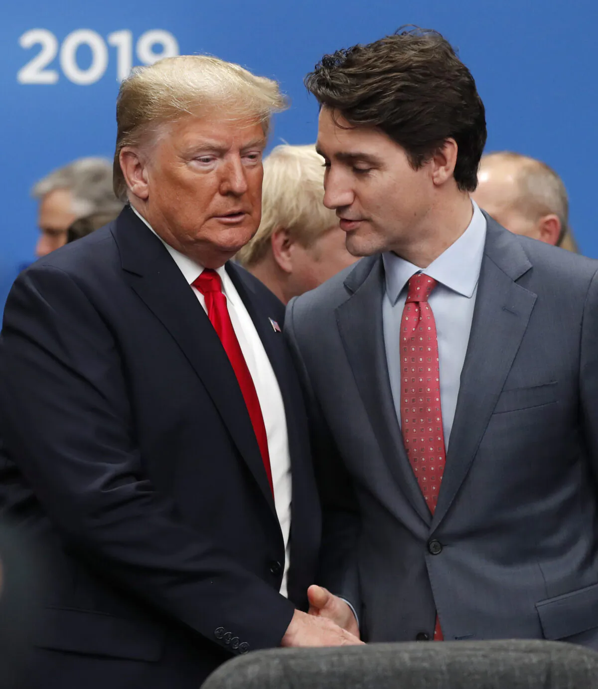 U.S. president Donald Trump and Canadian Prime Minister Justin Trudeau shake hands prior to a NATO round table meeting in Watford, Hertfordshire, England, on Dec. 4, 2019. (AP Photo/Frank Augstein)
