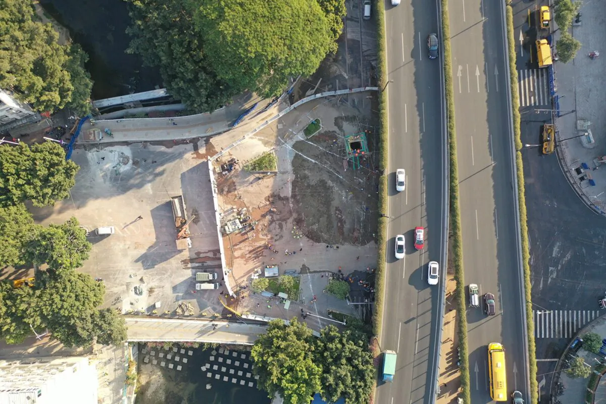 In this photo obtained by the Chinese-language Epoch Times, a big sinkhole that swallowed three people on Dec. 1 was completely filled hours later, when the victims may have still been alive. (The Epoch Times)