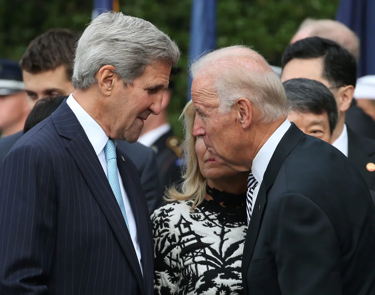 Then-Vice President Joe Biden, right, speaks with then-Secretary of State John Kerry in Washington in a 2015 file photograph. (Mark Wilson/Getty Images)