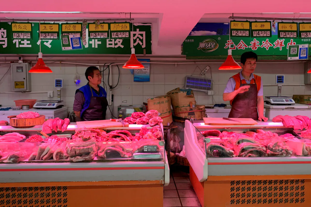 Pork vendors' stalls at a market in Beijing, China on Nov. 11, 2019. (Fang Nanlin/Reuters)