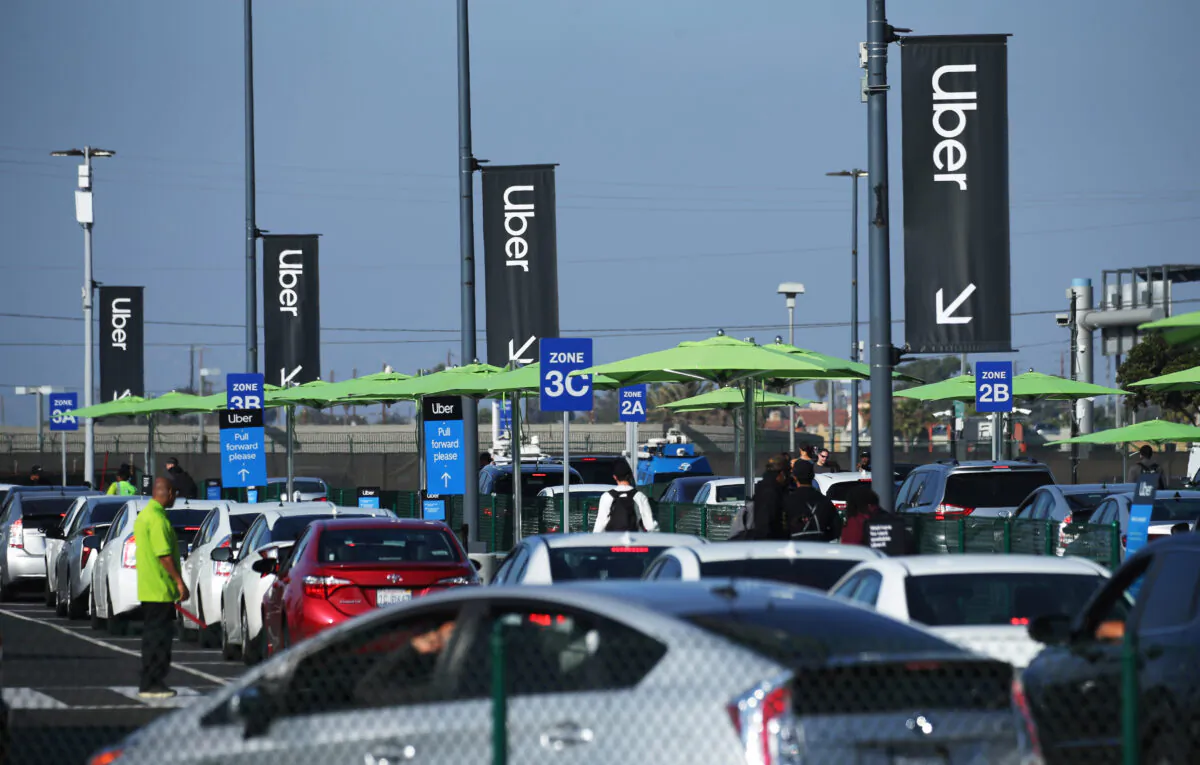 Uber vehicles line up at the new 'LAX-it' ride-hail passenger pickup lot at Los Angeles International Airport (LAX) in Los Angeles, Calif., on Nov. 6, 2019. (Mario Tama/Getty Images)