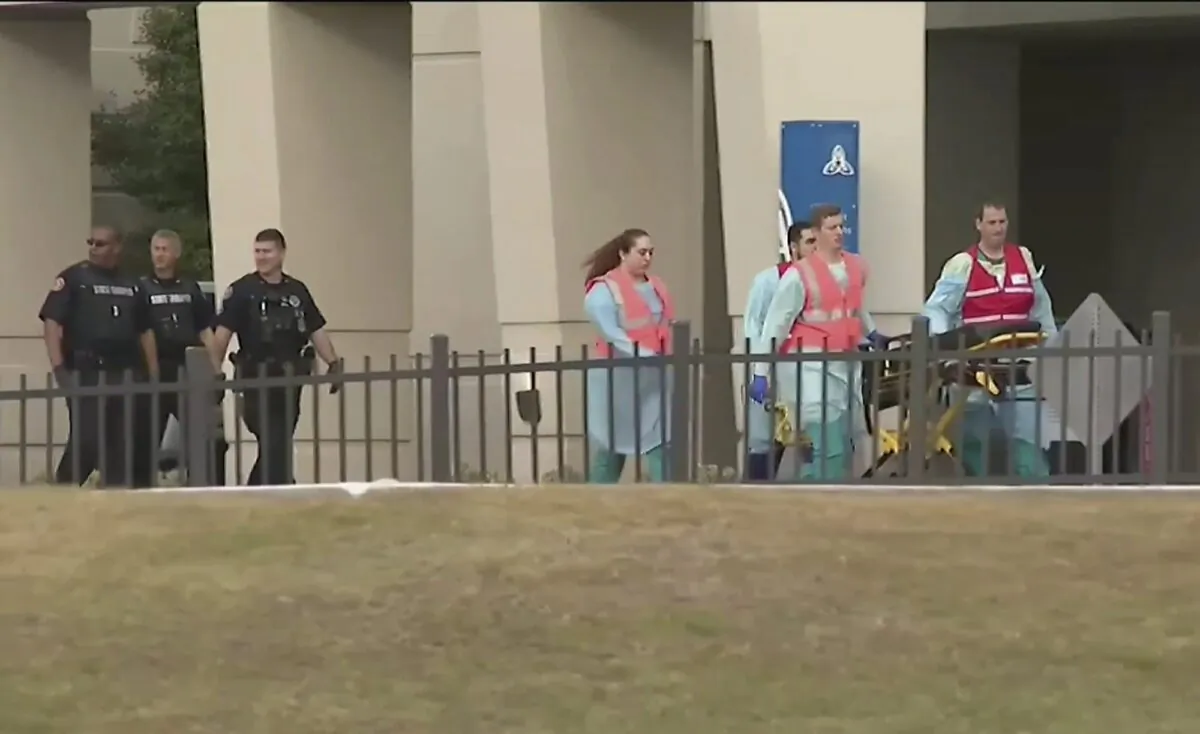 Emergency responders near the Naval Air Base Station in Pensacola, Fla., on Dec. 6, 2019. (WEAR-TV via AP)