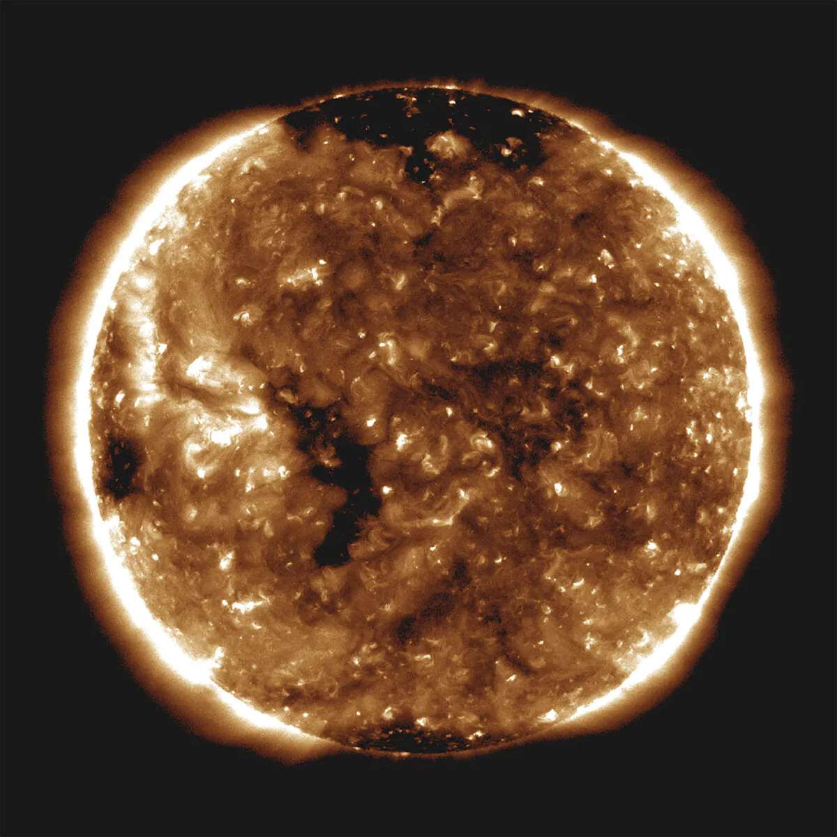 NASA's Parker Solar Probe observed a slow solar wind flowing out from the small coronal hole—the long, thin black spot seen on the left side of the sun in this image captured by NASA's Solar Dynamics Observatory on Oct. 27, 2018. (NASA/Handout via Reuters)