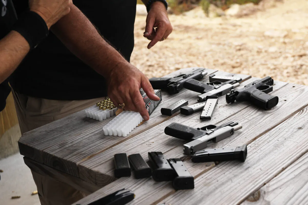 Pistols and other weapons are displayed at a shooting range during a festival in Greeley, Pa., in a file photograph. (Spencer Platt/Getty Images)