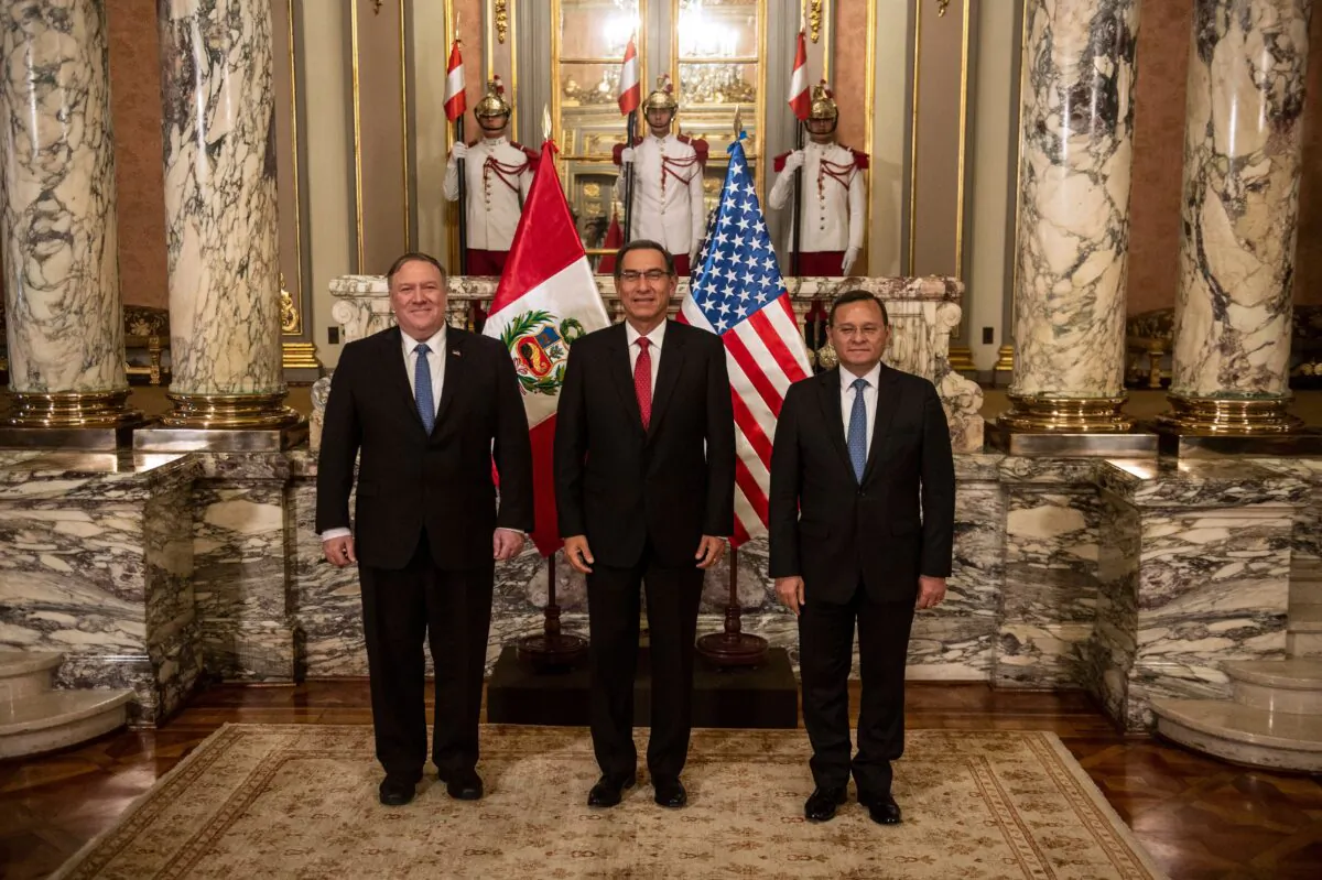 (L-R) US Secretary of State Mike Pompeo, Peru's President Martin Vizcarra and Peruvian Foreign Minister Nestor Popolisio pose for pictures at the Governement Palace in Lima, Peru on April 13, 2019. - Pompeo landed in Peru on Saturday on the third-leg of a four-nation tour of Latin American allies focusing heavily on Venezuela and countering China's economic reach. (Ernesto Benavides/AFP via Getty Images)