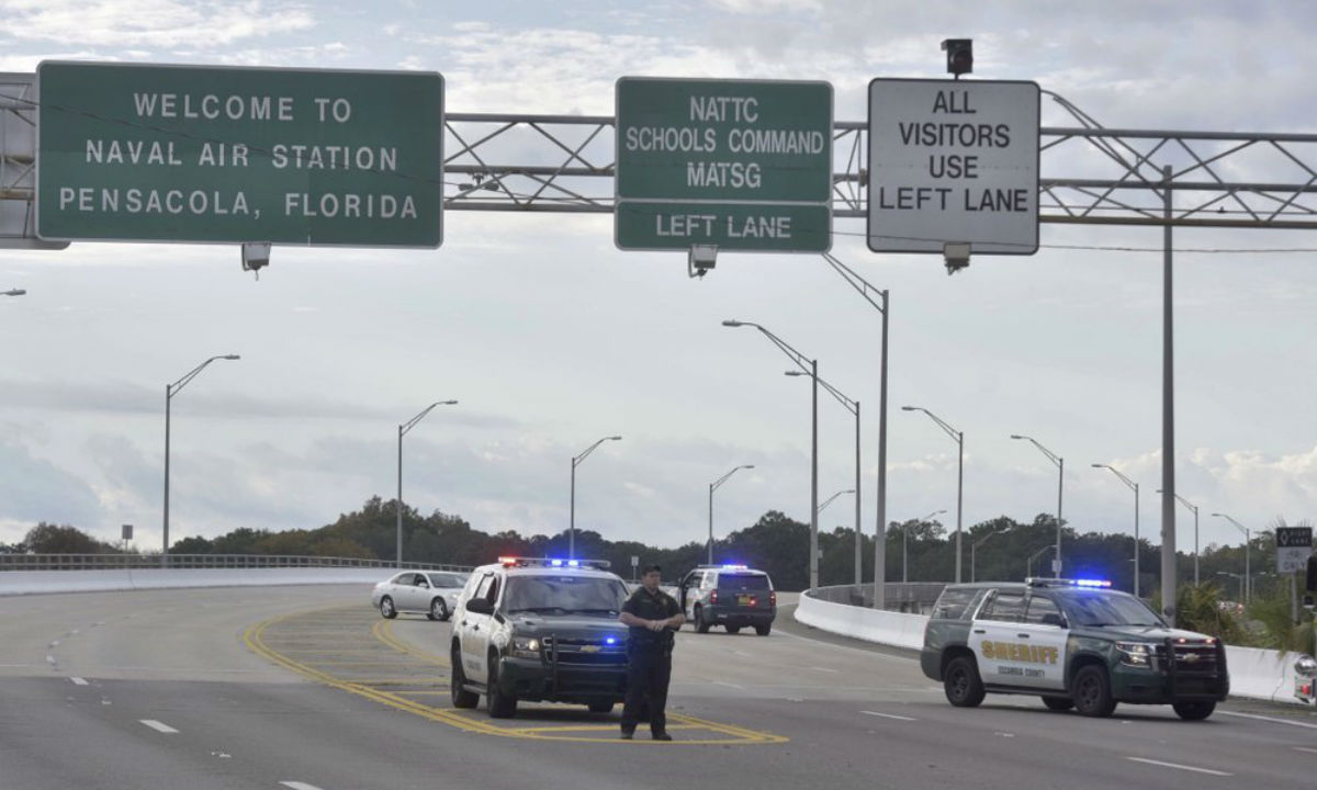Police vehicles block the entrance