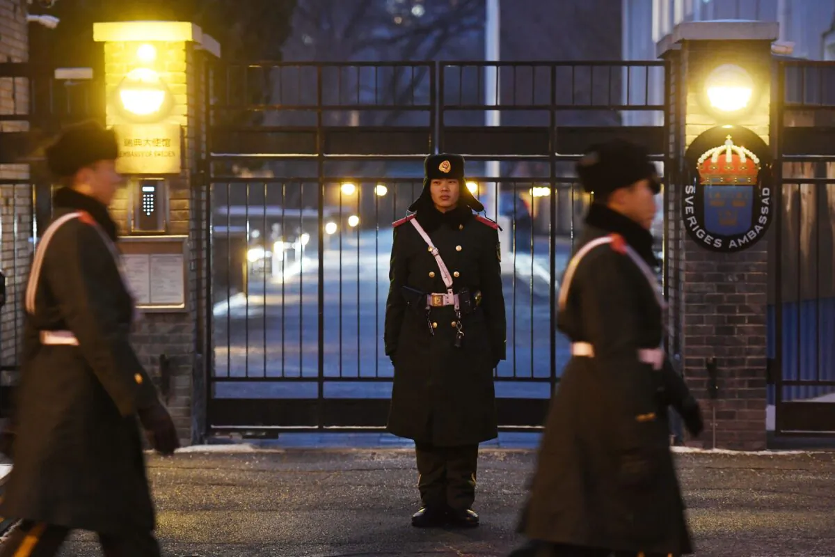 Paramilitary police officers patrol outside the Swedish embassy in Beijing on Feb. 14, 2019. - Sweden's ambassador to Beijing has been recalled to Stockholm after claims she brokered an unauthorized meeting over the fate of detained Chinese-Swedish bookseller Gui Minhai, the Swedish foreign ministry said on Feb. 14. (Greg Baker/AFP via Getty Images)