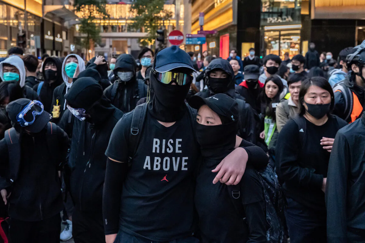 Protesters form a frontline during a standoff with police at a demonstration in Hong Kong on December 8, 2019. (Anthony Kwan/Getty Images)