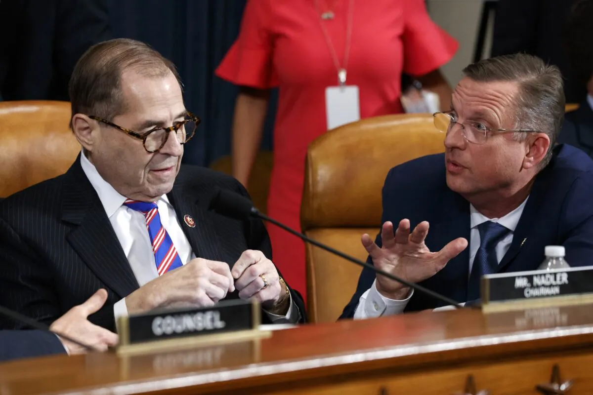 House Judiciary Committee Chairman Rep. Jerrold Nadler (D-N.Y.) (L), listens to ranking member Rep. Doug Collins (R-Ga.) after the House Judiciary Committee hearing on the constitutional grounds for the impeachment of President Donald Trump on Capitol Hill in Washington on Dec. 4, 2019. (Alex Brandon/AP Photo)