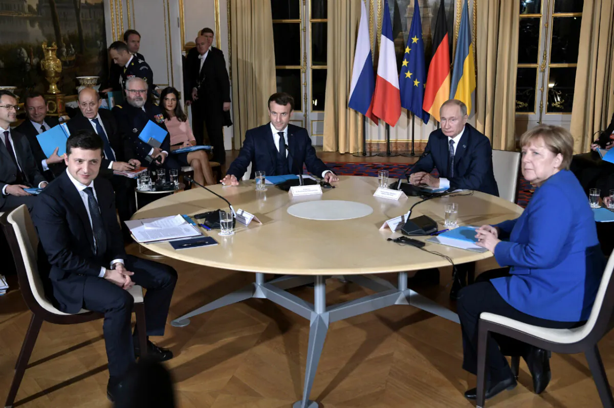 Ukrainian President Volodymyr Zelensky (L), French President Emmanuel Macron, Russian President Vladimir Putin, and German Chancellor Angela Merkel attend a Normandy-format summit in Paris, France, on Dec. 9, 2019. (Sputnik/Alexei Nikolsky/Kremlin via Reuters)