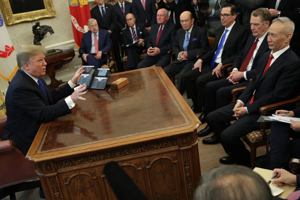 U.S. President Donald Trump (L) speaks during a meeting with Chinese Vice Premier Liu He (R) as other U.S. officials look on in the Oval Office of the White House on Feb. 22, 2019. (Alex Wong/Getty Images)