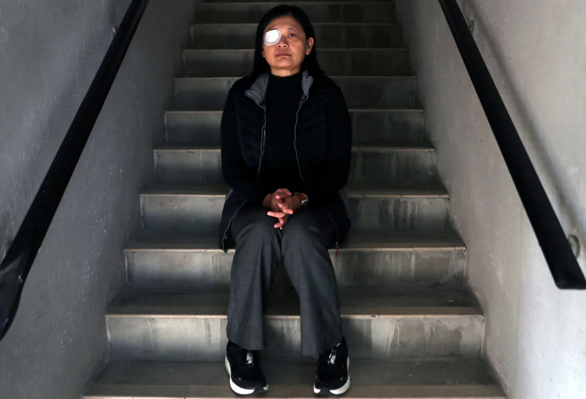 Indonesian journalist Veby Mega Indah, whose right eye was severely injured by Hong Kong police during a protest, poses for a portrait in Hong Kong, China on Dec. 4, 2019. (Leah Millis/Reuters)