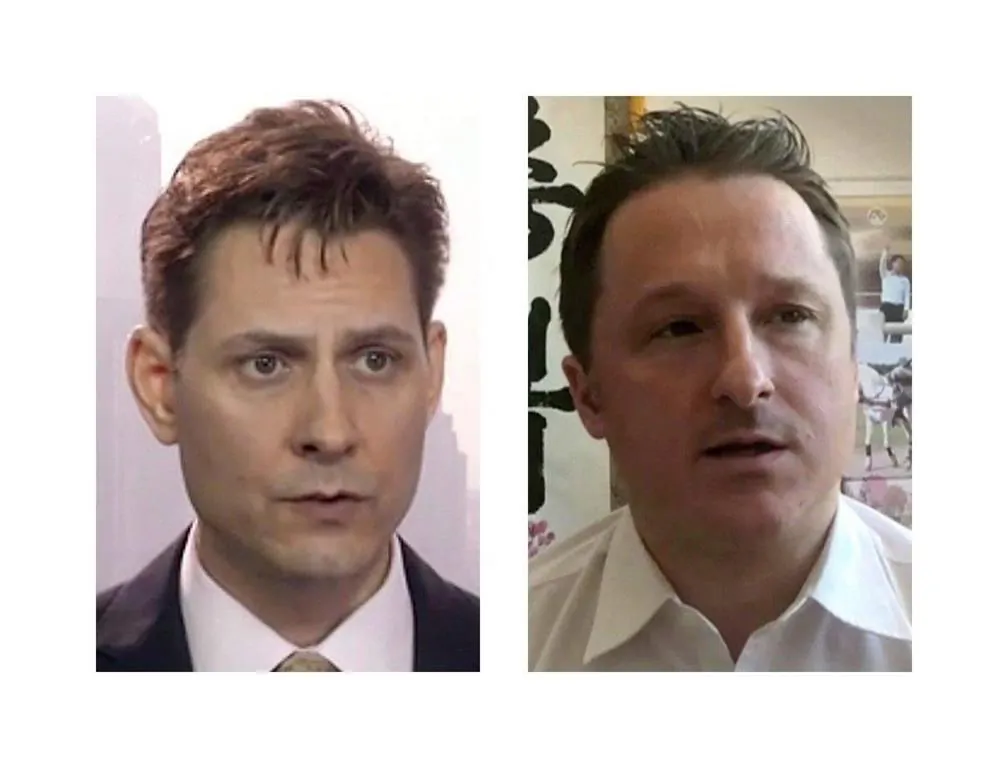 Michael Kovrig (L) and Michael Spavor have been detained in China for 1 year. (The Canadian Press)